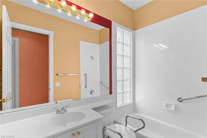 Full bath featuring vanity and shower / tub combination