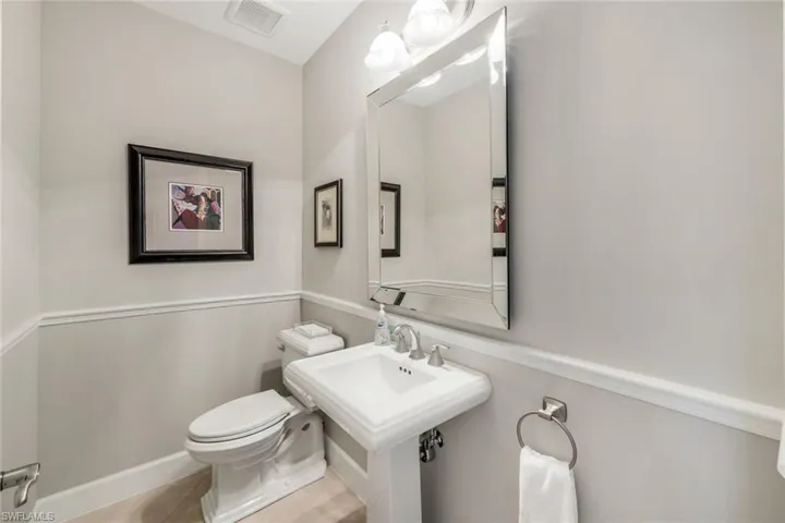 Bathroom with toilet and tile patterned floors