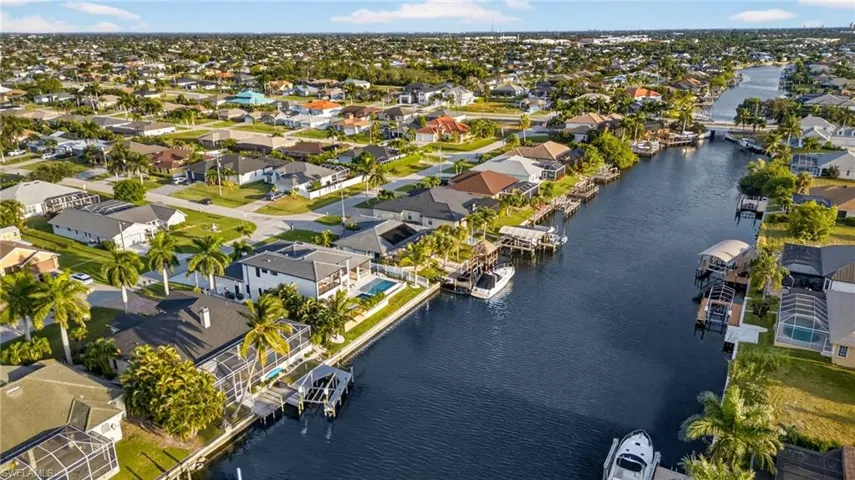 View of property location with nearby suburban area and a nearby body of water