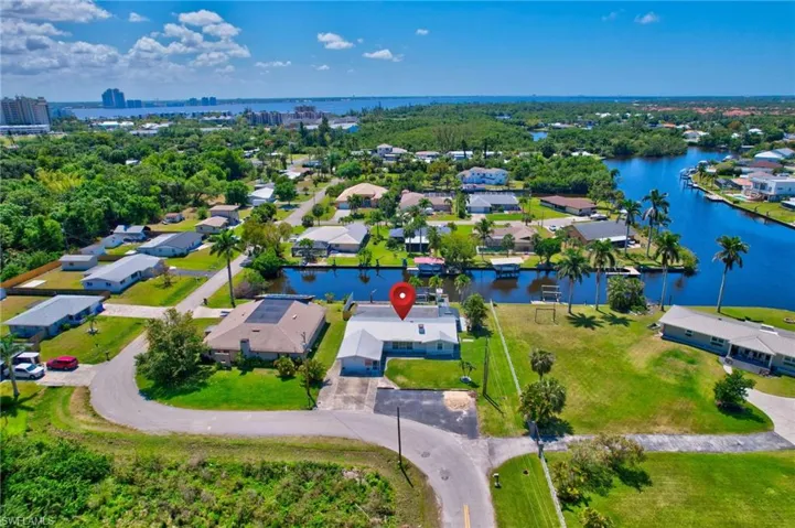 Drone / aerial view with a residential view and a water view