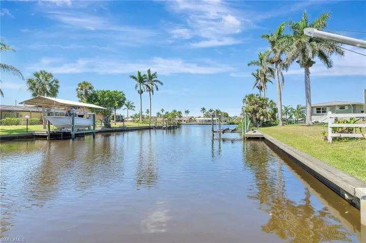 Dock area featuring a water view and boat lift