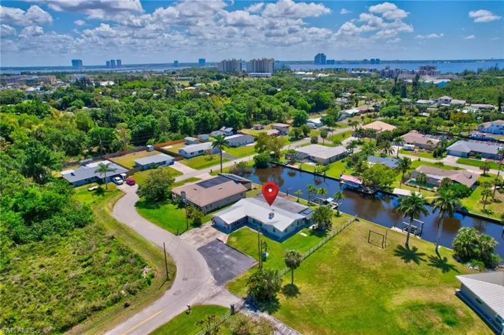 Bird's eye view with a residential view, a water view, and a view of city