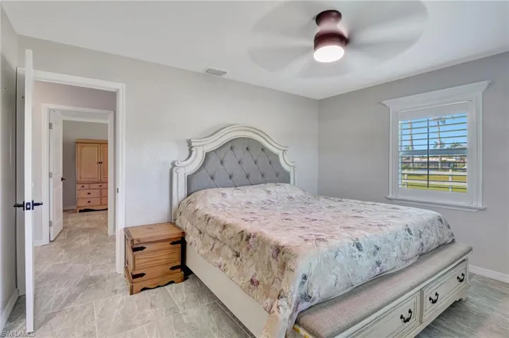 Bedroom with baseboards and a ceiling fan