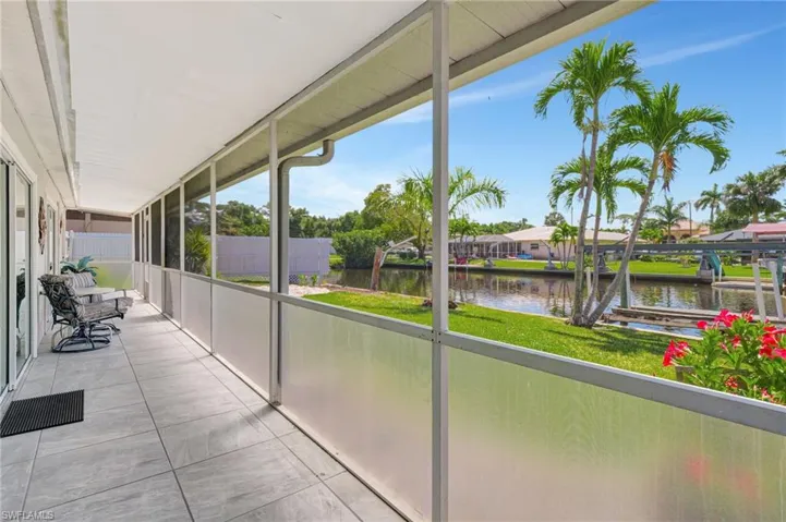 Unfurnished sunroom featuring a water view