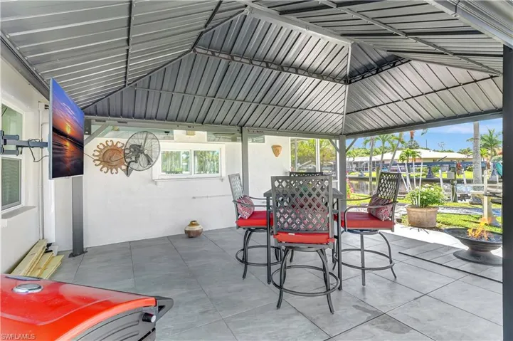 View of patio / terrace with outdoor dining area and a gazebo