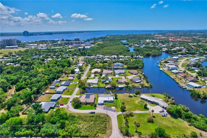 Aerial view featuring a residential view and a water view