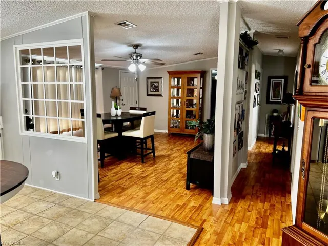 Dining space with ceiling fan, a textured ceiling