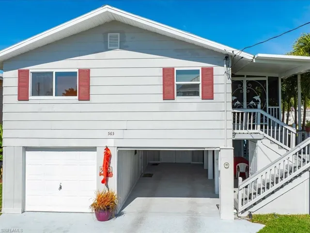 View of side of home with a garage