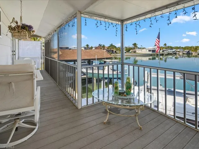 Wooden terrace featuring a water view