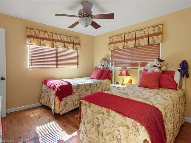 Bedroom with wood-type flooring and ceiling fan