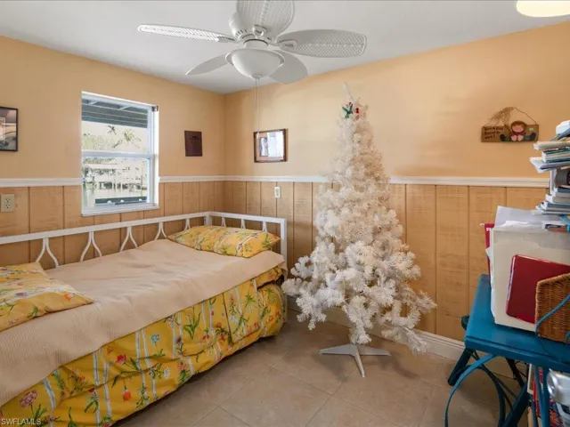 Bedroom featuring tile patterned floors and ceiling fan