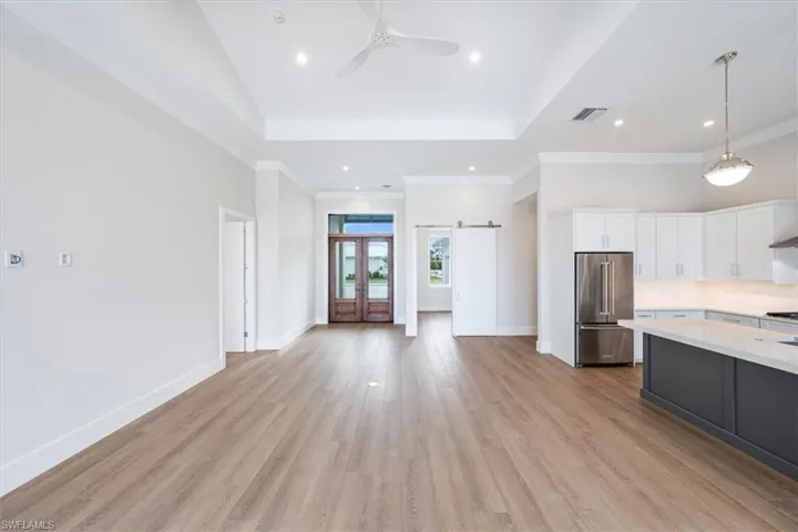 The open concept Palm plan features a great room with vaulted great room ceiling, 10' sliders and doors.