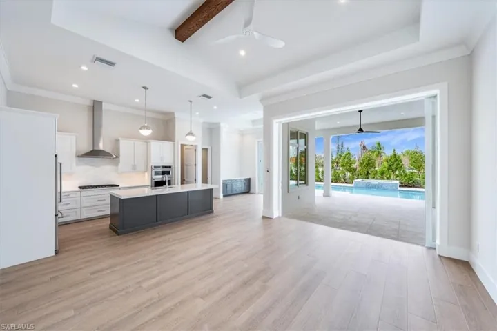 The open concept Palm plan features a great room with vaulted great room ceiling, 10' sliders and doors.