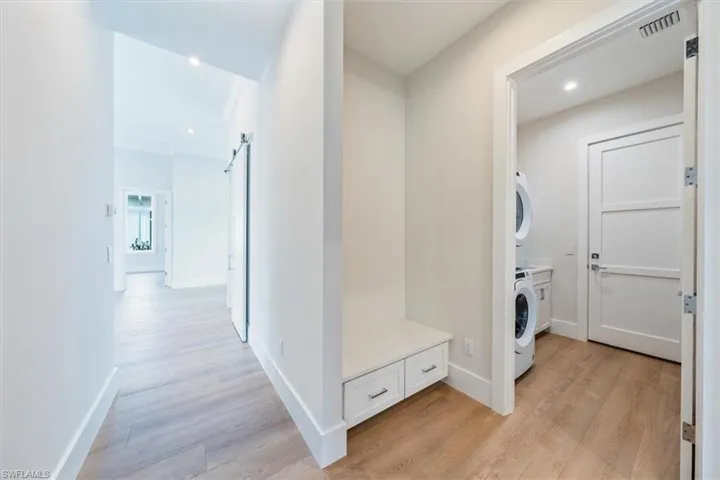 The laundry room and mudroom bench are located just off of the garage.