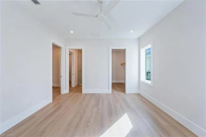 Bedroom 2 features a large walk-in closet and direct access to bathroom 2.