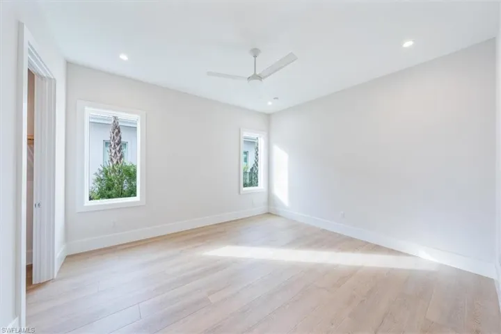 Bedroom 2 features a large walk-in closet and direct access to bathroom 2.