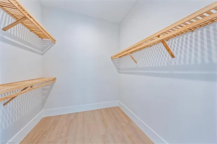 Bedroom 2 features a large walk-in closet and direct access to bathroom 2.