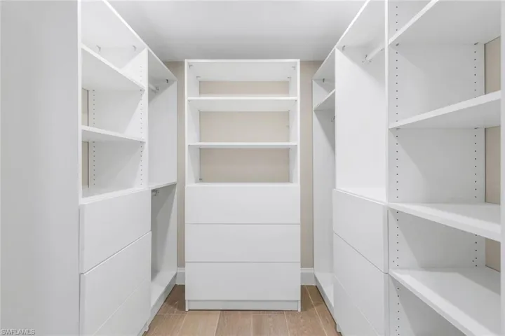 Walk in closet featuring light wood-type flooring
