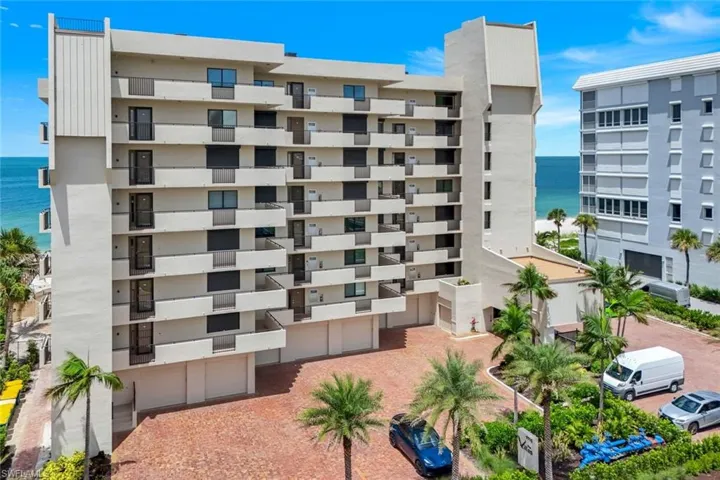 View of apartment building / complex featuring a water view