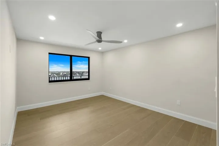 Spare room featuring wood finished floors, recessed lighting, and ceiling fan