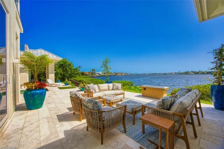 View of patio / terrace with outdoor lounge area and a water view