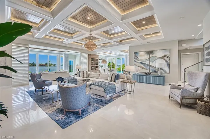 Common area featuring coffered ceiling and beam ceiling
