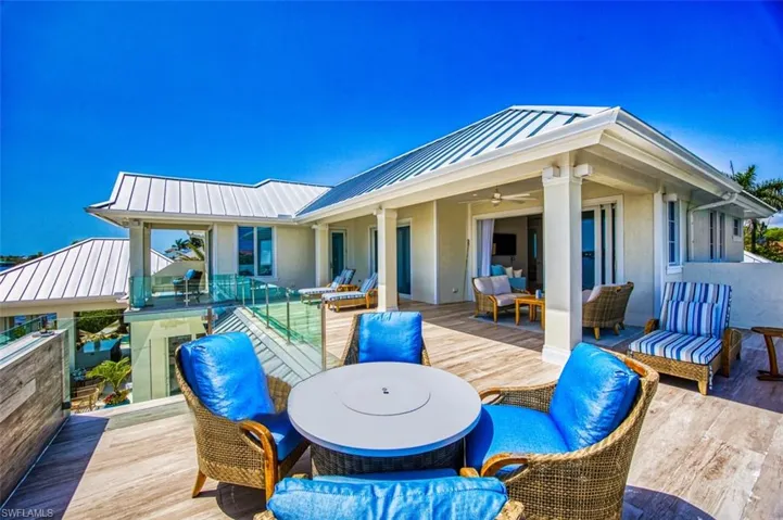 Wooden deck featuring an outdoor living space, ceiling fan, and outdoor dining space