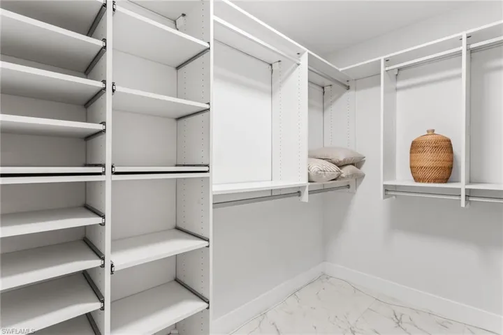 Large Primary walk in closet the shelving.