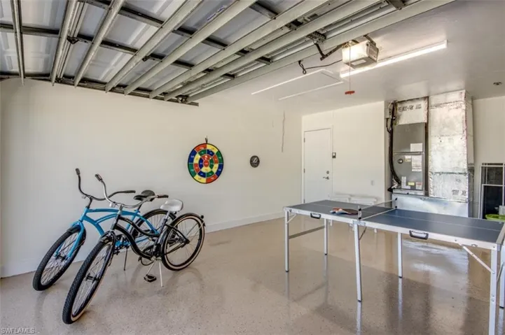 The garage features a polished concrete floor and bright overhead lighting