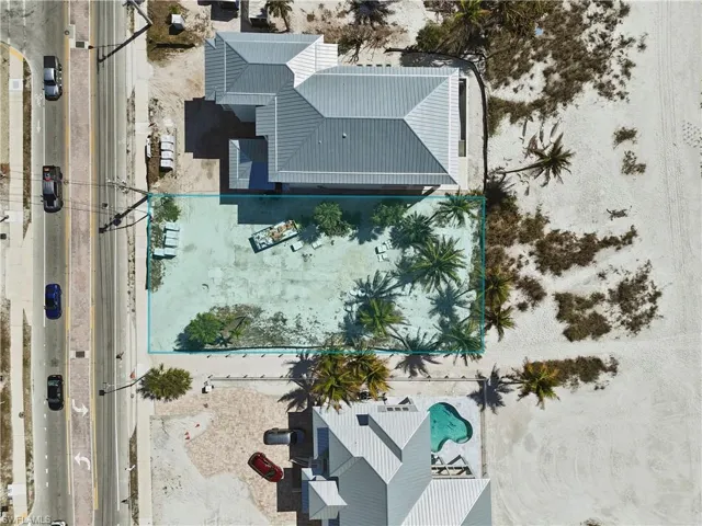 View of subject property with a pool area