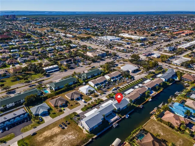 Aerial overview of property's location featuring a nearby body of water