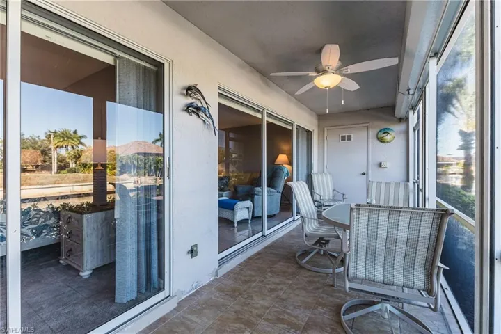 Sunroom featuring a ceiling fan