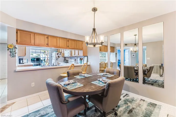 Dining space with a chandelier and light tile patterned floors