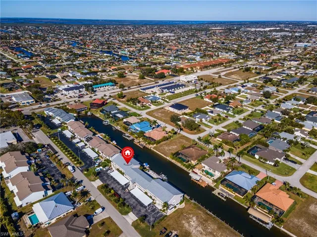 View of property location with nearby suburban area and a large body of water
