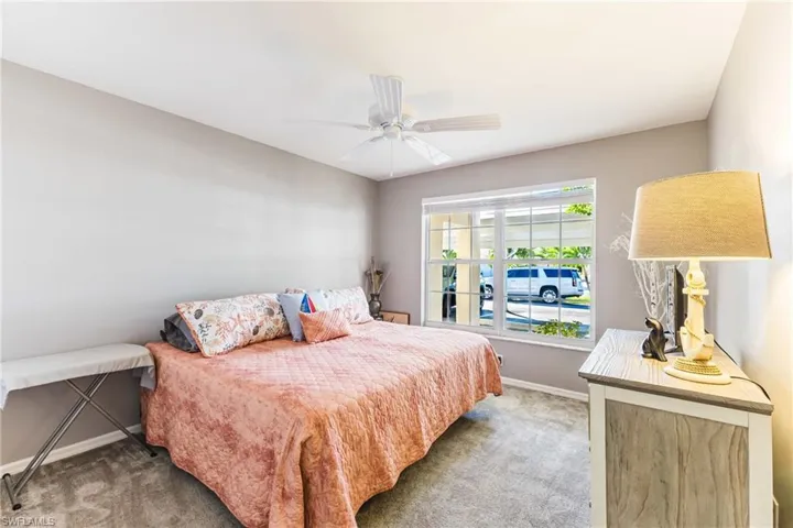 Bedroom with carpet and ceiling fan