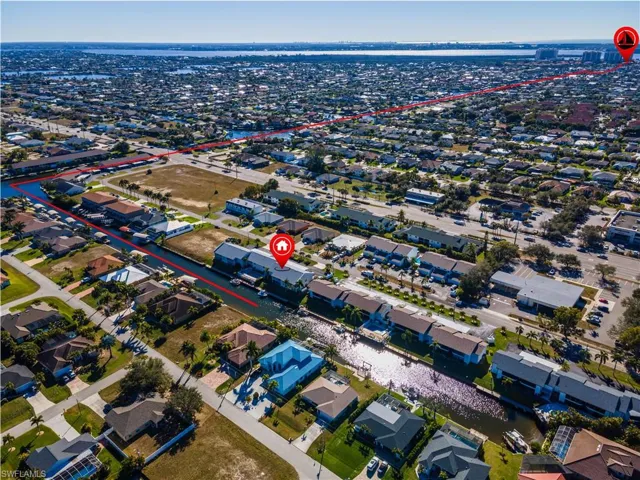 View of property location with nearby suburban area
