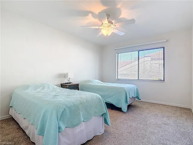 Bedroom featuring carpet and a ceiling fan