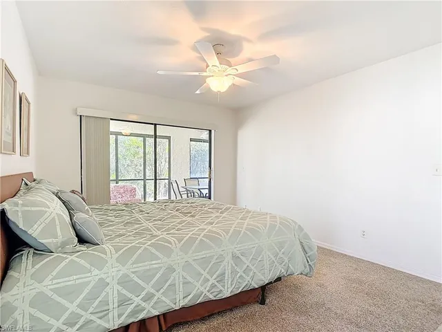 Bedroom with carpet flooring and ceiling fan