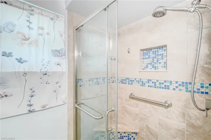 Bathroom featuring a shower with shower door