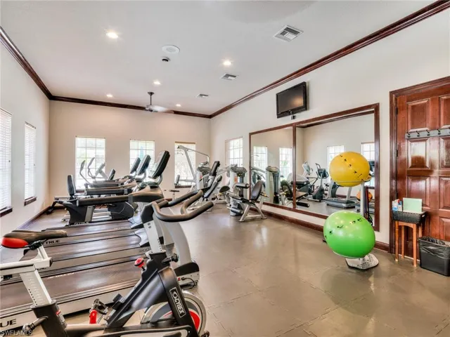 Exercise room featuring crown molding and recessed lighting