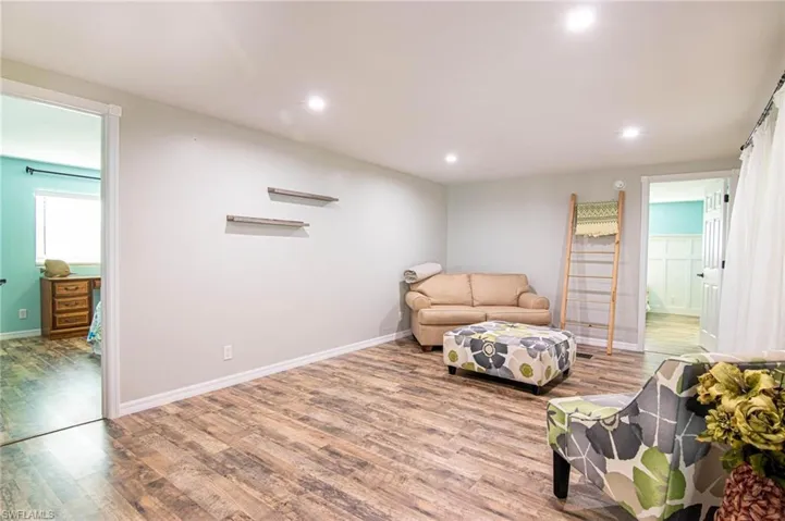 Sitting room featuring light wood-type flooring