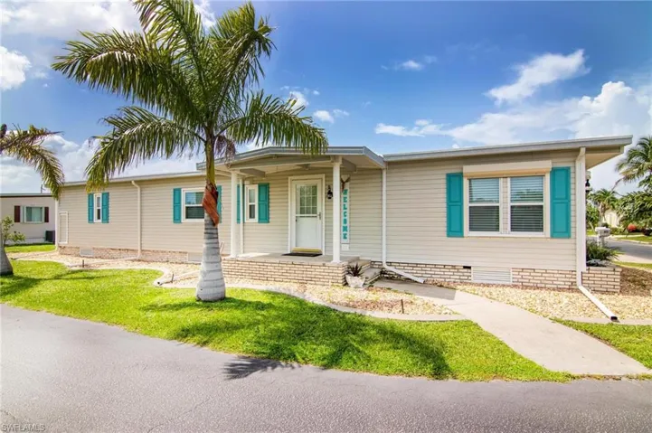 View of front of property with a front lawn