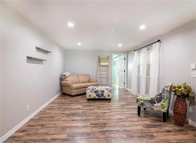 Living room featuring dark wood-type flooring