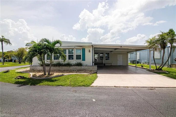 View of front of property featuring a carport