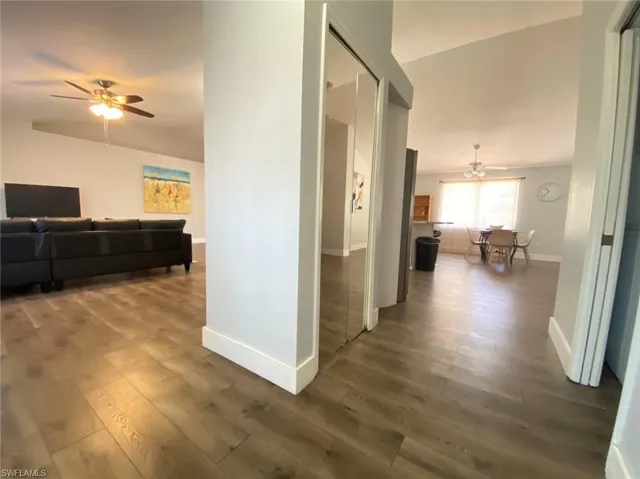 Corridor featuring dark hardwood / wood-style floors