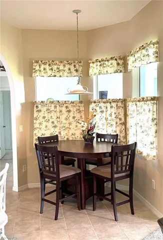 Dining room featuring light tile patterned floors