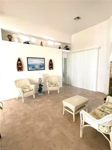 Living room featuring light tile patterned floors