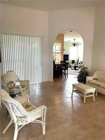 Tiled living room with ceiling fan