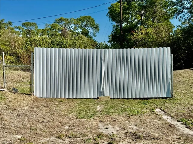 Double gate to backyard.
