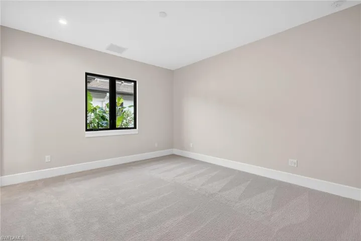 Bedroom 1 light earth tone pallet with light colored carpet